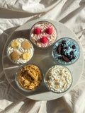 Top down view of all Petit Bisou candles together, dessert-inspired and handmade in New York