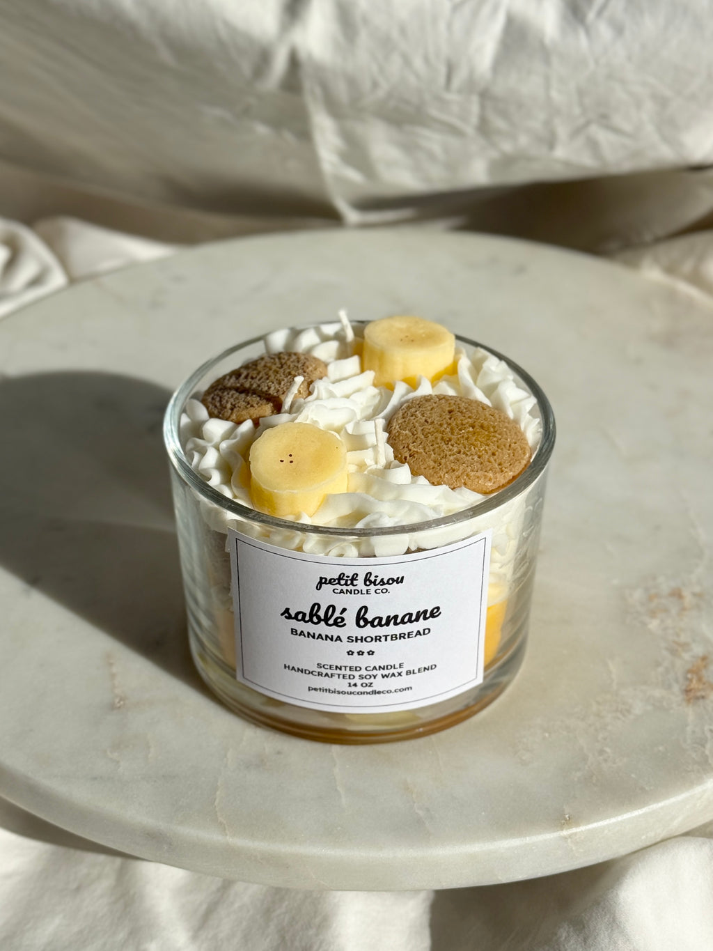 Front view of hand-poured Banana Shortbread scented candle by Petit Bisou, dessert-inspired and handmade in New York