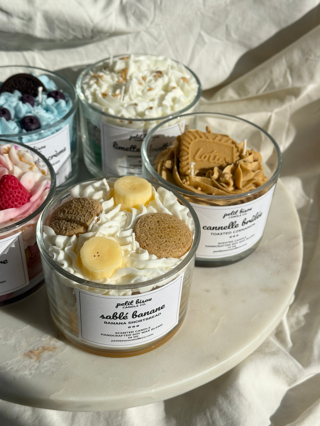 Group shot of hand-poured Banana Shortbread scented candles by Petit Bisou, dessert-inspired and handmade in New York
