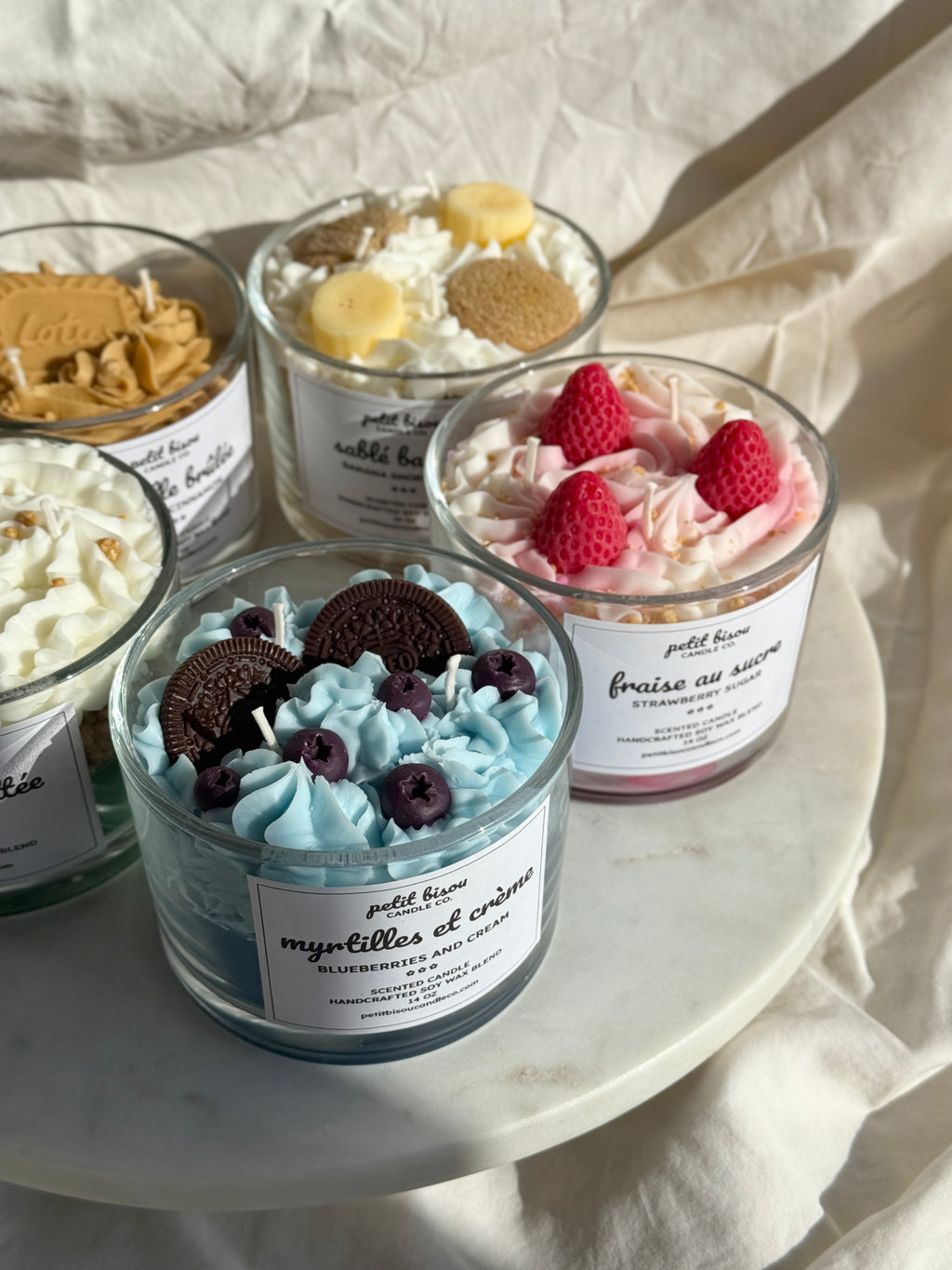 Group shot of hand-poured blueberry cream oreo scented candles by Petit Bisou, dessert-inspired and handmade in New York
