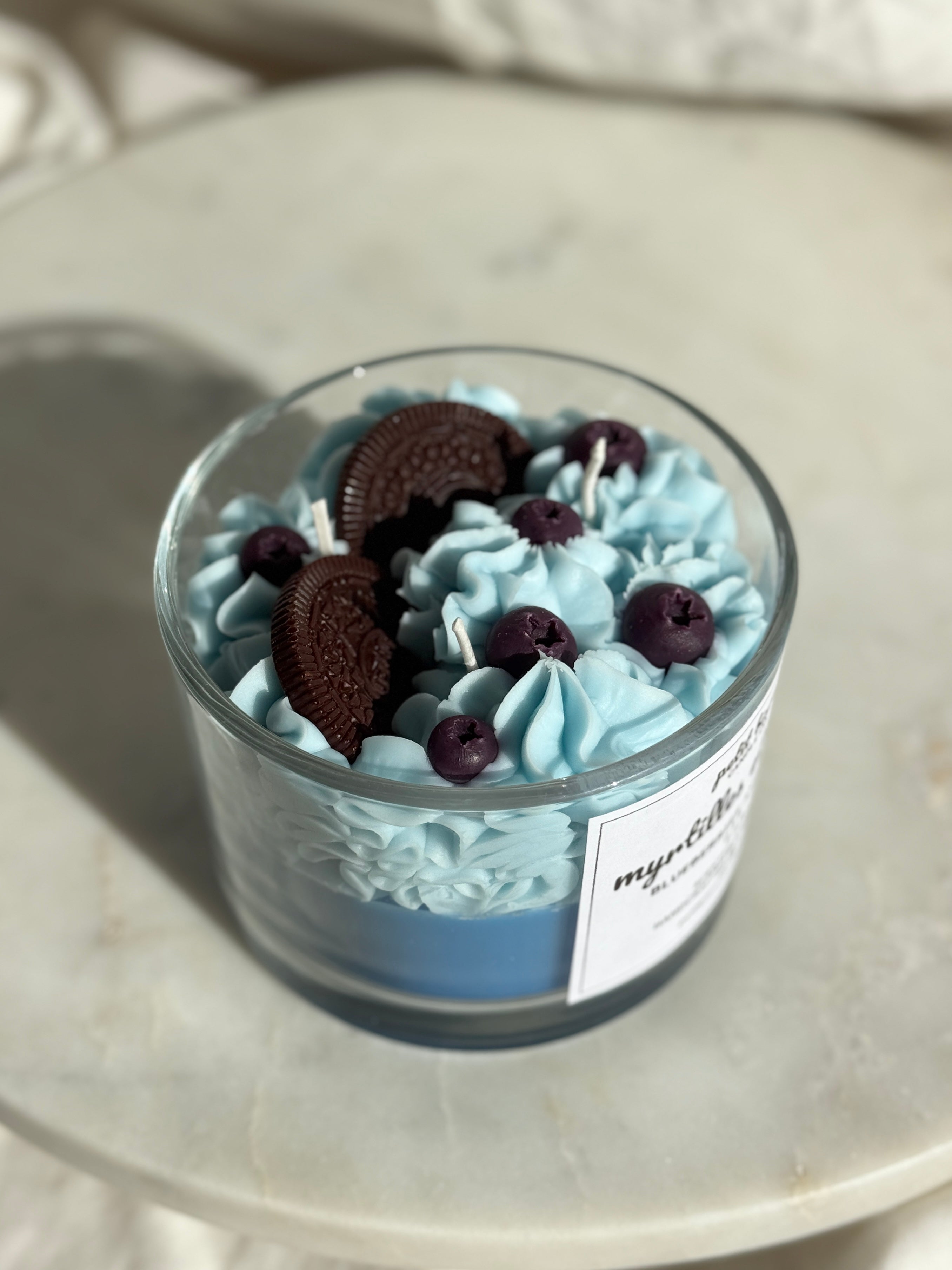 Top view of hand-poured blueberry cream oreo scented candle by Petit Bisou, dessert-inspired and handmade in New York