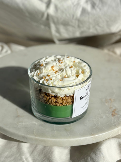 Side view of hand-poured key lime pie scented candle by Petit Bisou, dessert-inspired and handmade in New York